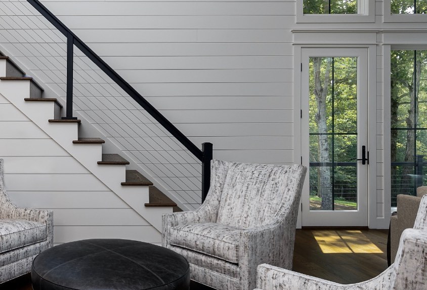 Shiplap stairwell and sitting area with cable railing
